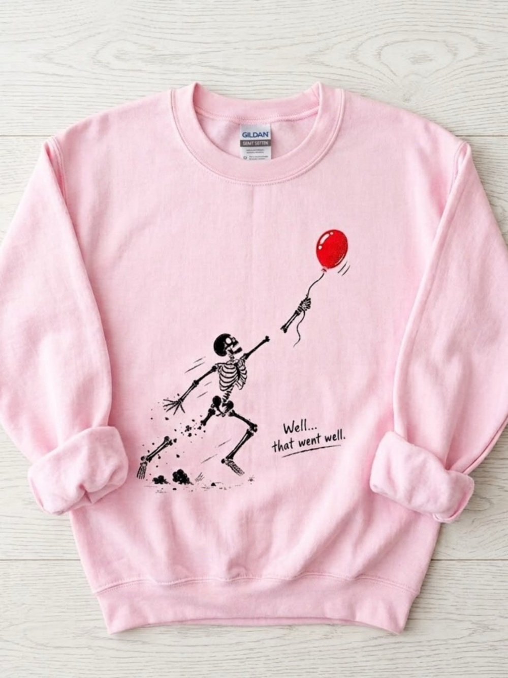 Gildan Pink Crewneck Sweatshirt with Skeleton Chasing Red Balloon Graphic